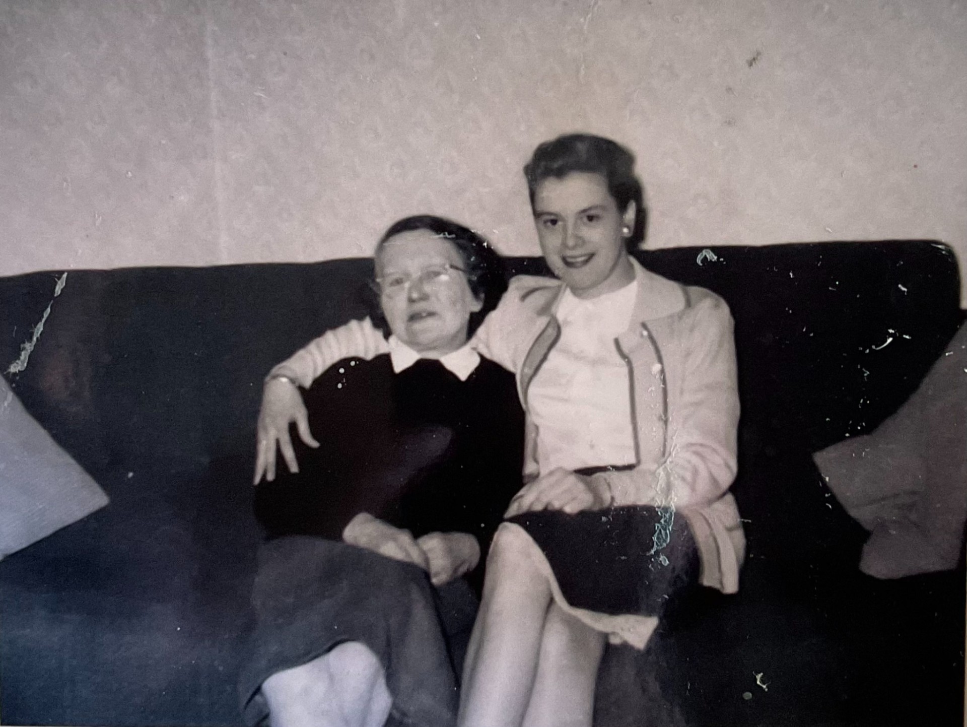 Mother and daughter on the sofa — before restoration