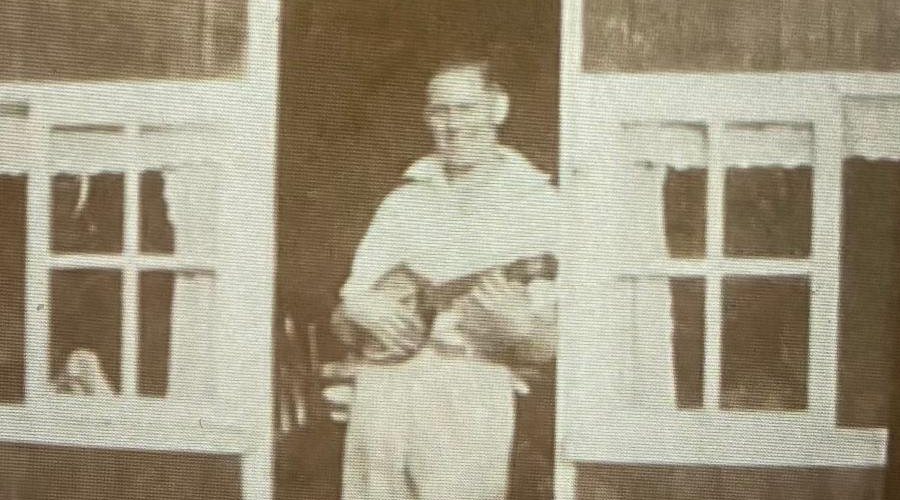 Faded sepia family photograph before restoration